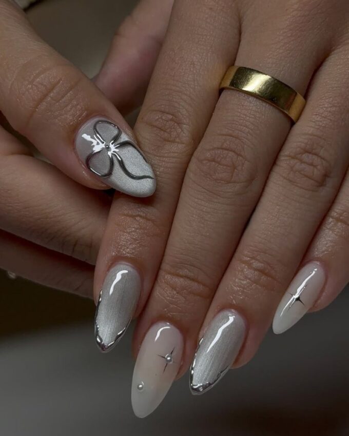 srebrne paznokcie z efektem „cat eye”, srebrna kokardka